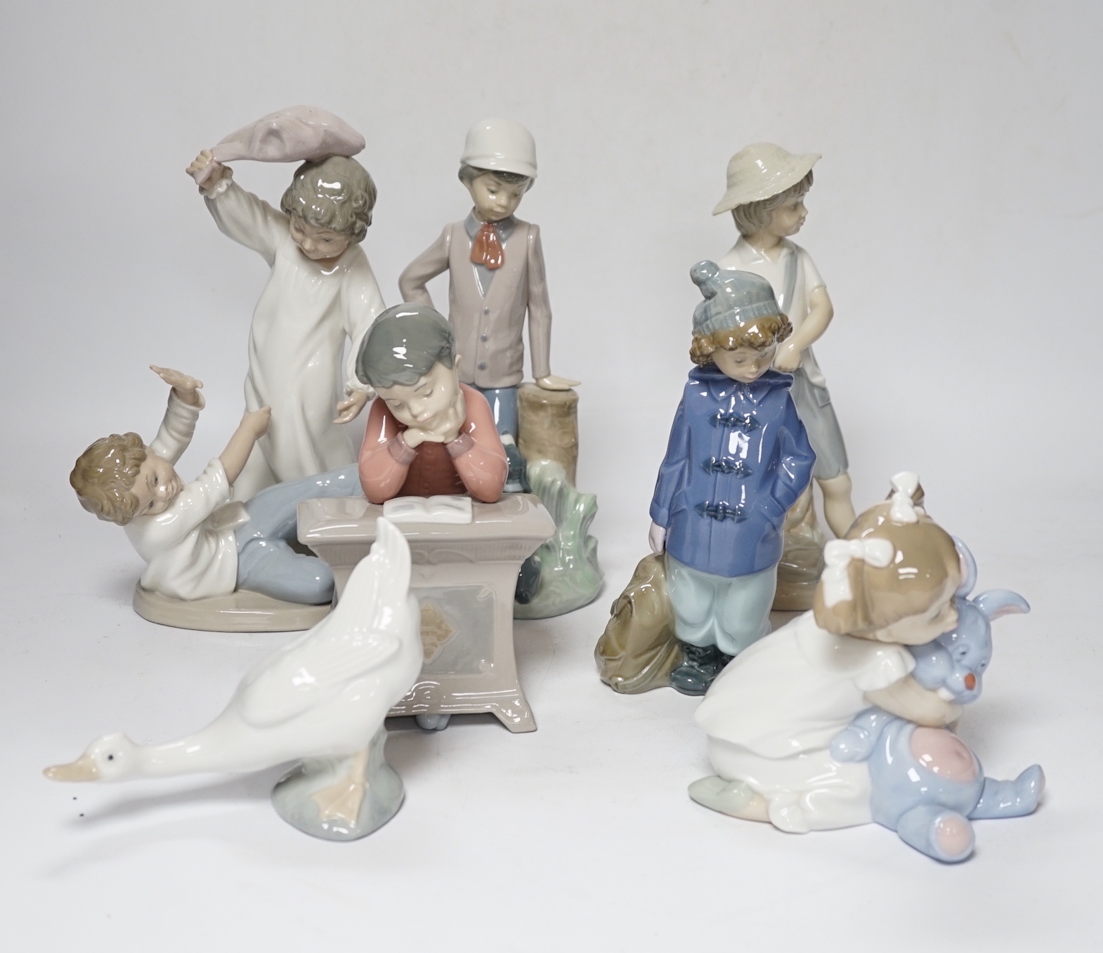 Six mixed Nao figure groups of children play and a duck, four boxed, tallest 23.5cm (7)